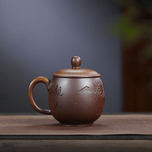 Handmade Yixing purple sand tea cup with lid, featuring mountain design, ideal for tea lovers seeking artisan craftsmanship.