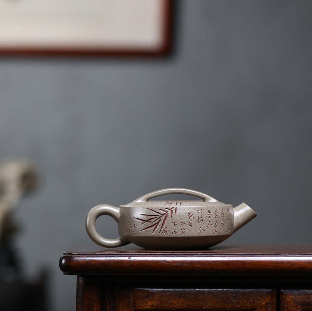 Handmade Yixing purple sand teapot with bamboo design, crafted by Yixing artisans, perfect for home kung fu tea ceremonies.