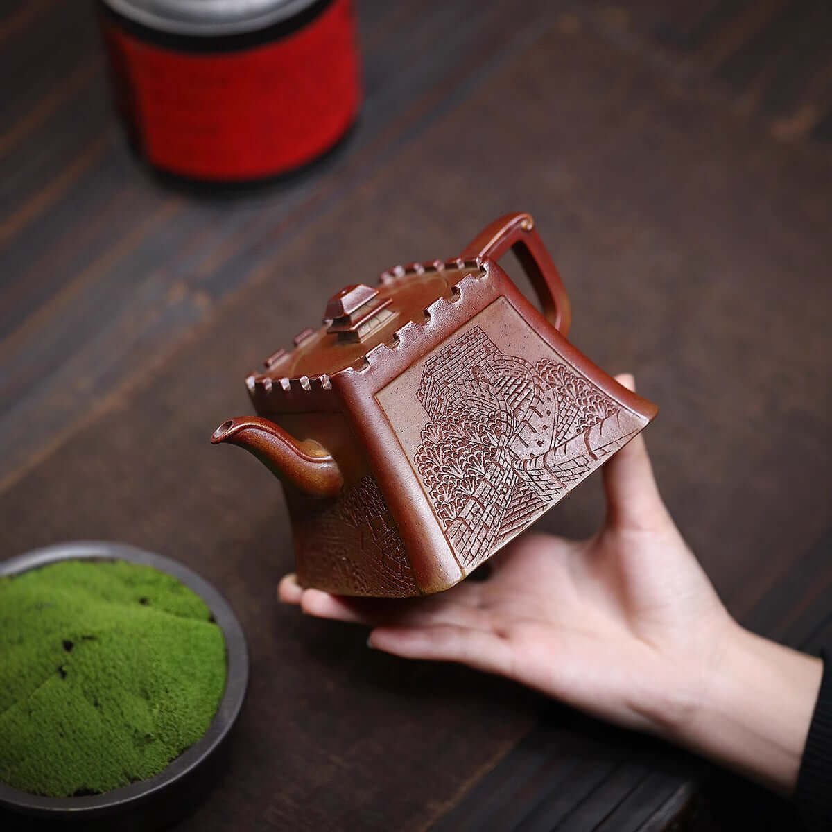 Handmade Yixing purple sand teapot showcasing ancient craftsmanship and intricate design, perfect for tea enthusiasts.