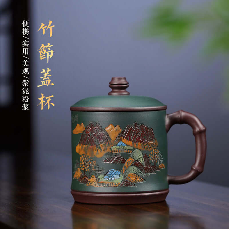 Handmade Yixing purple sand mug with landscape engraving, perfect for tea ceremonies and collectors.