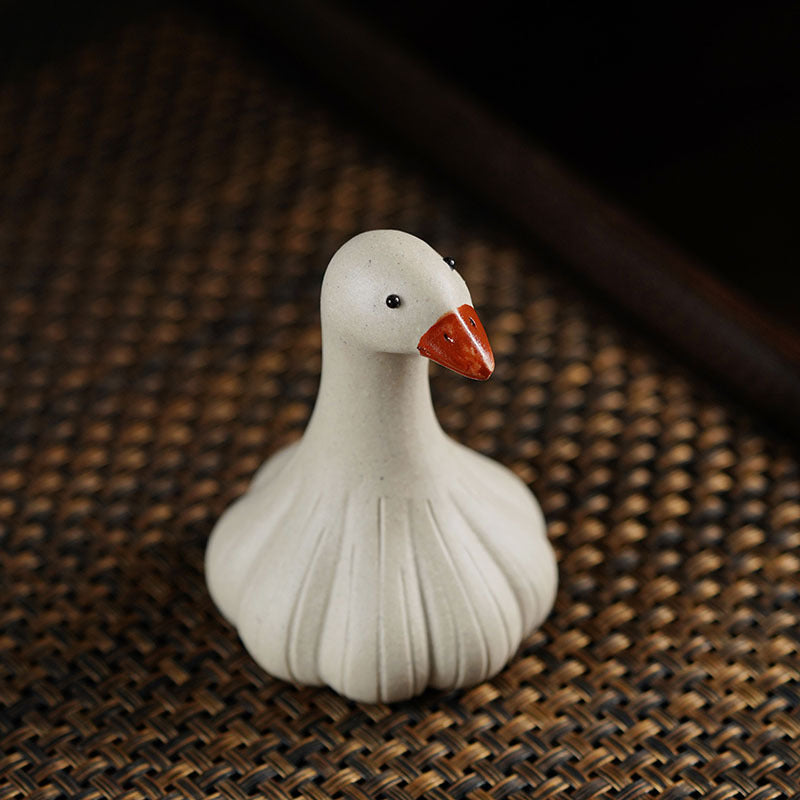 Handmade Yixing purple sand tea pet ornament, cute goose decoration for tea tables and ceremonies, crafted with original materials.