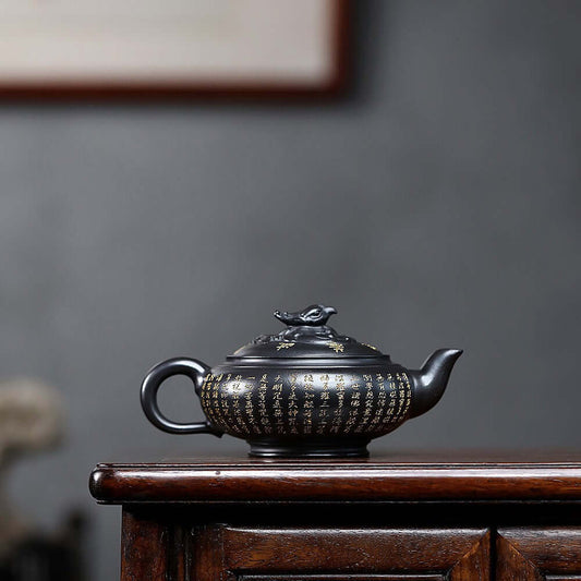 Handmade Yixing purple sand teapot with elegant designs, perfect for home tea sets and tea ceremonies.