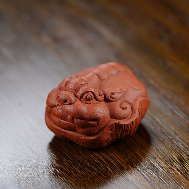Handmade Yixing purple sand tea pet sculpture, featuring a charming turtle design for tea table decor.