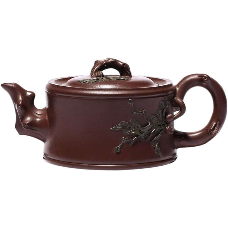 Handmade Yixing purple sand teapot with intricate leaf design, showcasing traditional craftsmanship and unique aesthetics.