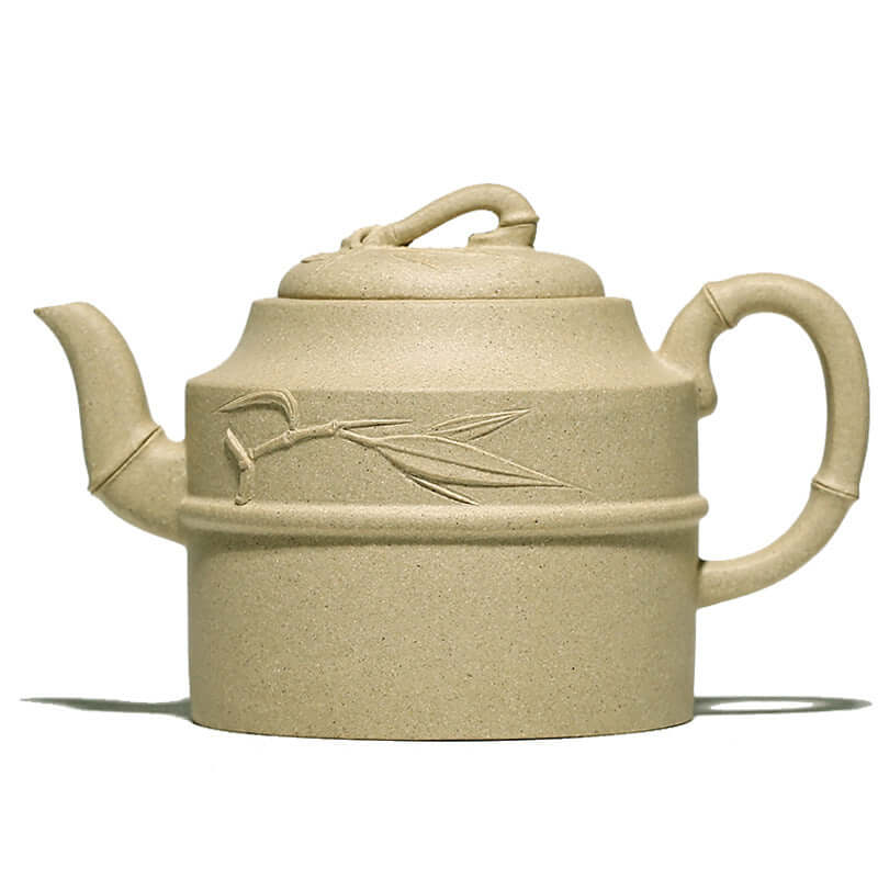 Handmade Yixing purple sand teapot with bamboo design, showcasing craftsmanship in natural raw ore.