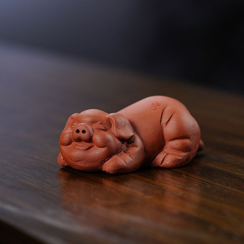 Handmade Yixing purple sand pig Bajie sculpture, perfect for tea table decoration and craft collection.