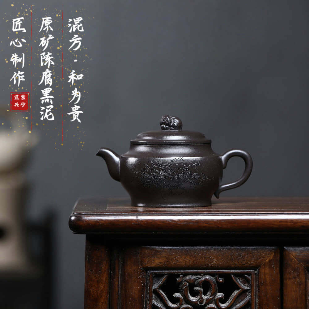 Handmade Yixing purple sand teapot with intricate design, perfect for Kung Fu tea ceremonies.