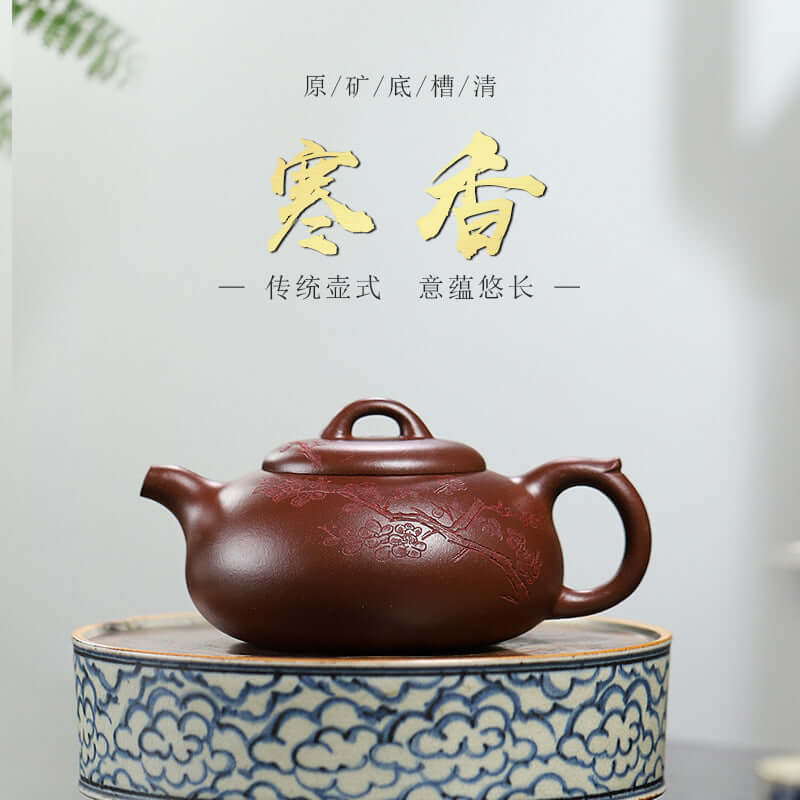 Handmade Yixing purple sand teapot displayed on a decorative plate, showcasing traditional craftsmanship.