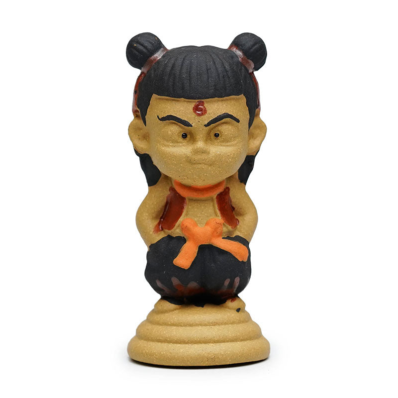 Handmade Yixing purple sand tea pet ornament featuring Nezha anime character, crafted by skilled artisans.