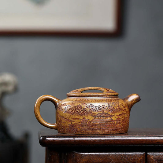 Handmade Yixing purple sand teapot with intricate mountain design, showcasing original craftsmanship and high-temperature raw ore.