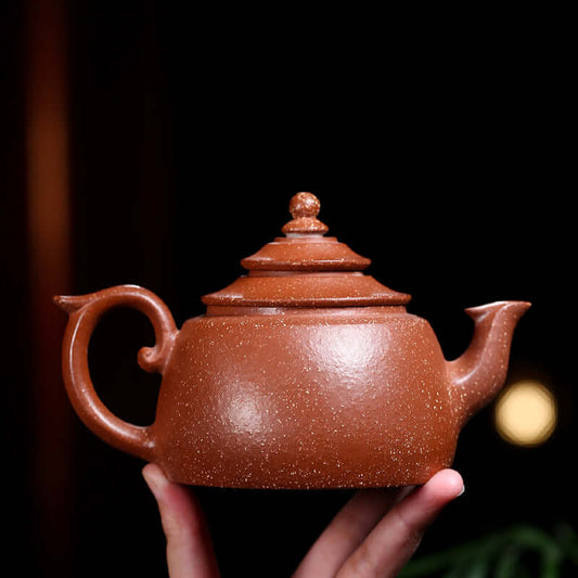 Handmade Yixing purple sand teapot showcasing elegant design and craftsmanship, perfect for kung fu tea ceremonies.