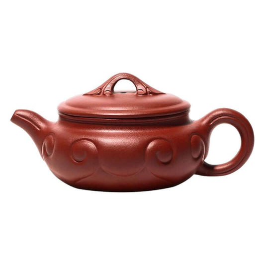 Handmade Yixing purple sand teapot with elegant design and smooth curves, perfect for traditional tea serving.
