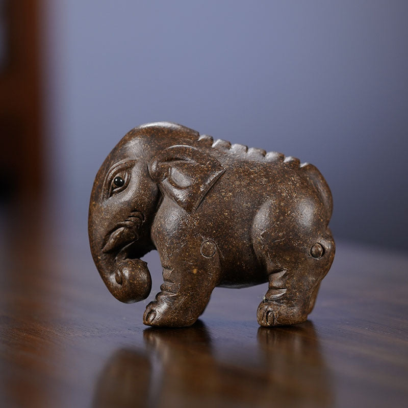 Handmade Yixing purple sand elephant sculpture decorative art for tea table or home decor.