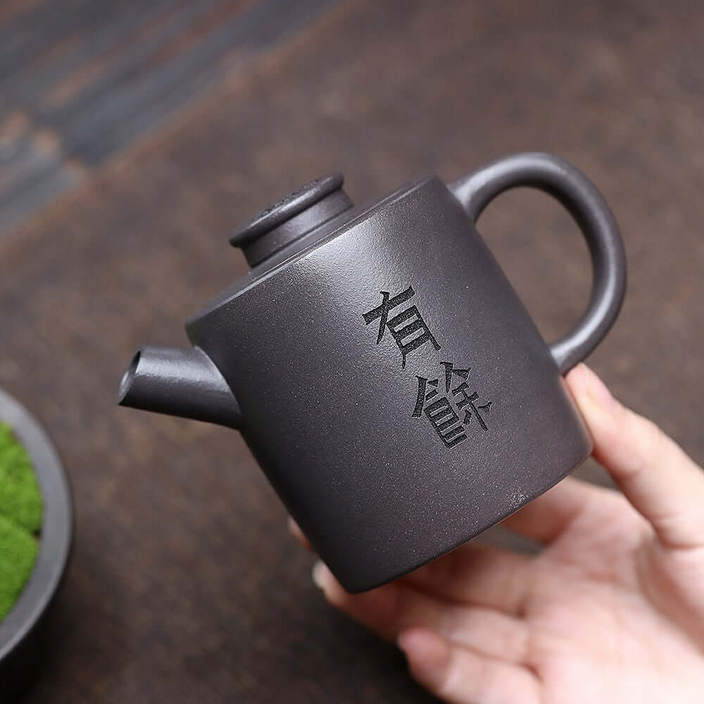 Handmade Yixing purple sand teapot featuring unique craftsmanship and elegant design, ideal for Kung Fu tea sets.