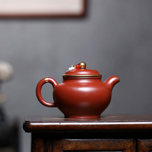 Handmade Yixing purple sand teapot with gold inlay, original mineral surface, ideal for Kung Fu tea set.