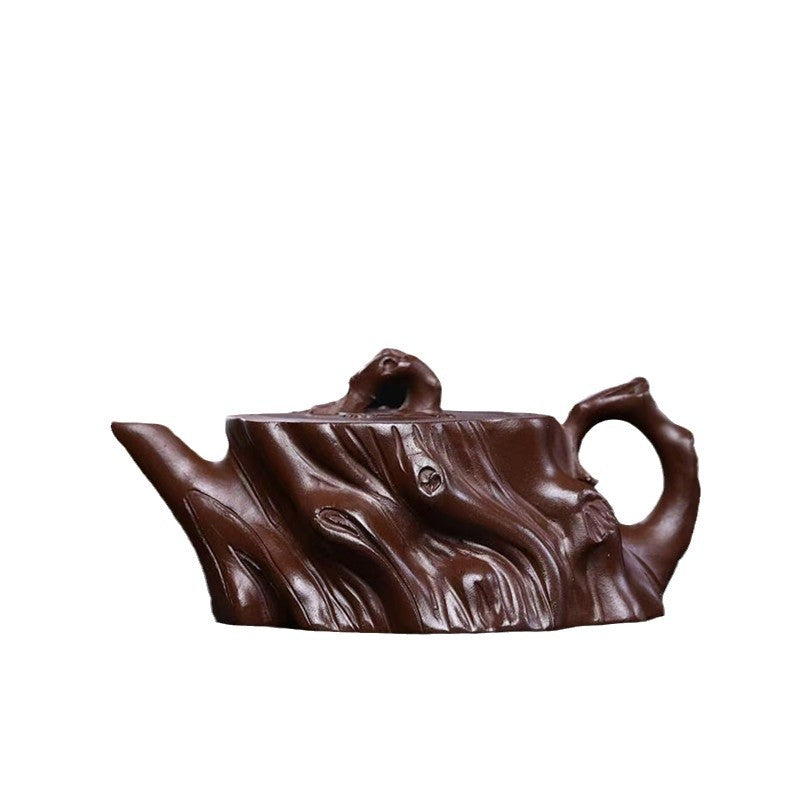 Handmade Yixing purple sand teapot in the shape of a plum tree stump, showcasing fine craftsmanship.