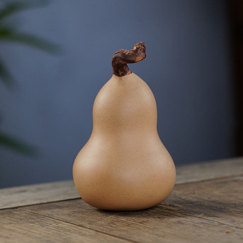 Handmade Yixing purple sand tea pet gourd sculpture, crafted from original purple sand for tea enthusiasts.