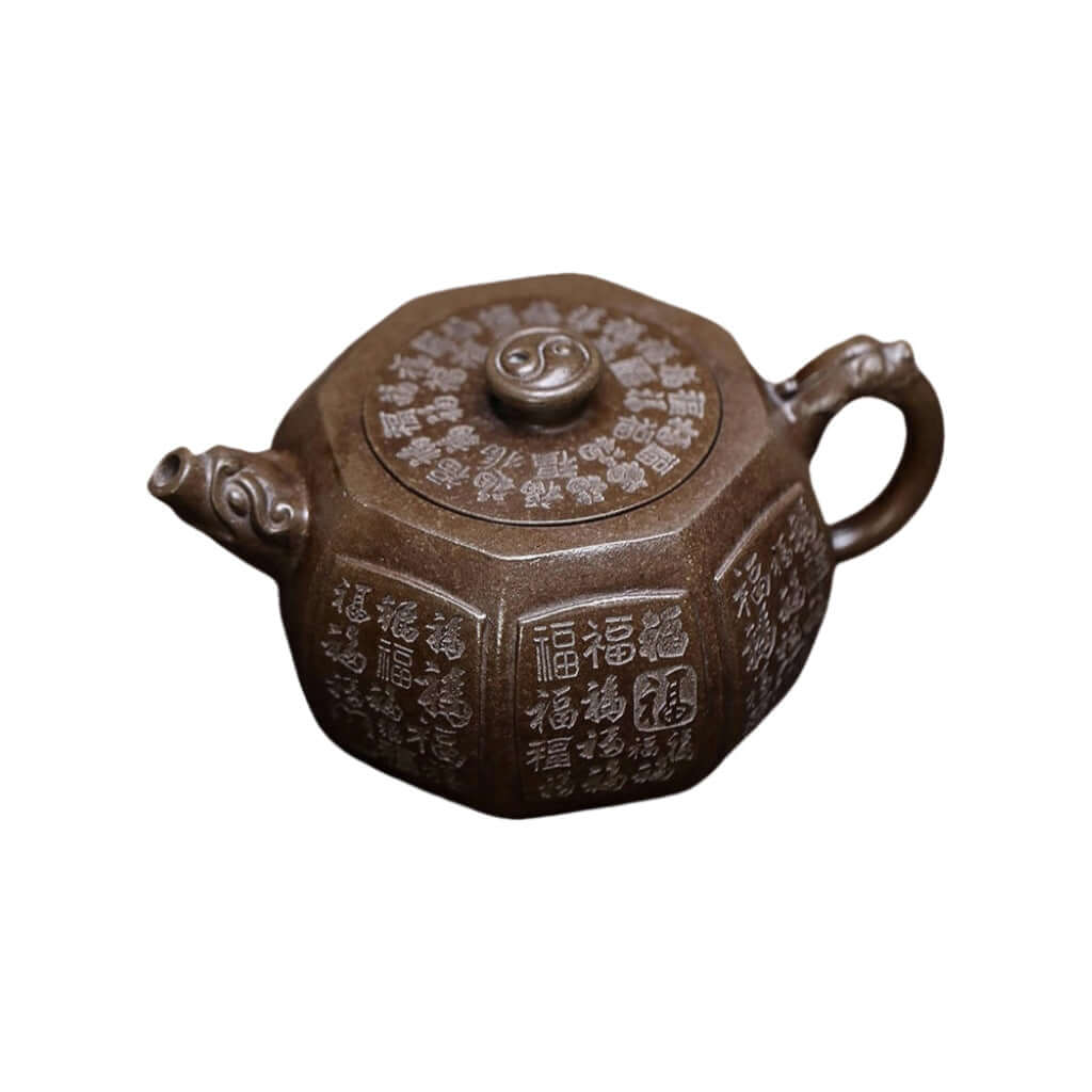 Handmade Yixing purple sand teapot with ancient copper mud, featuring intricate ciphered designs, perfect for Kung Fu tea.