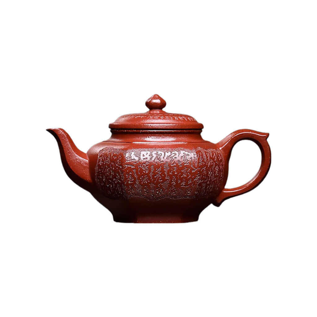 Handmade Yixing purple sand teapot in red slope mud, featuring detailed craftsmanship for an elegant kung fu tea set.
