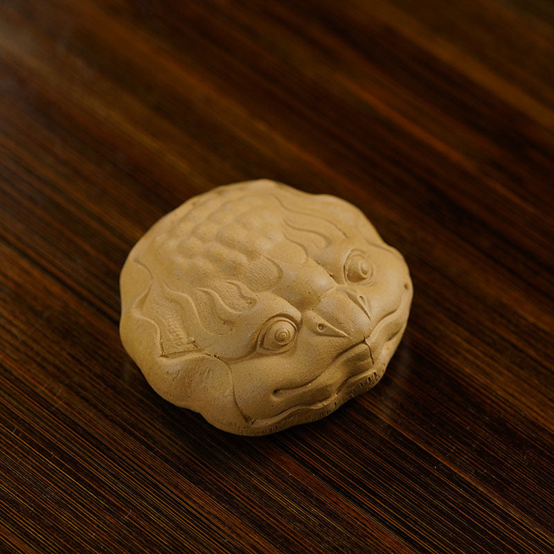 Handmade Yixing purple sand tea pet ornament featuring a frog design, perfect for tea enthusiasts.