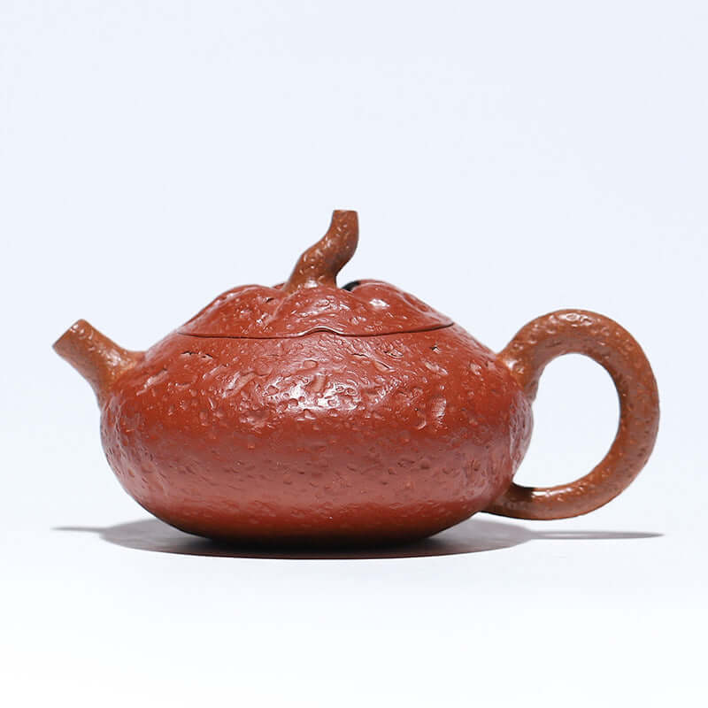 Handmade Yixing purple sand teapot resembling an orange, 120cc capacity, crafted by artisan Jiang Jingming.