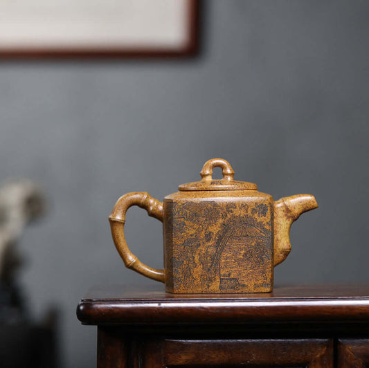 Handmade Yixing purple sand teapot with bamboo handle, crafted from raw ore for authentic kung fu tea experience.