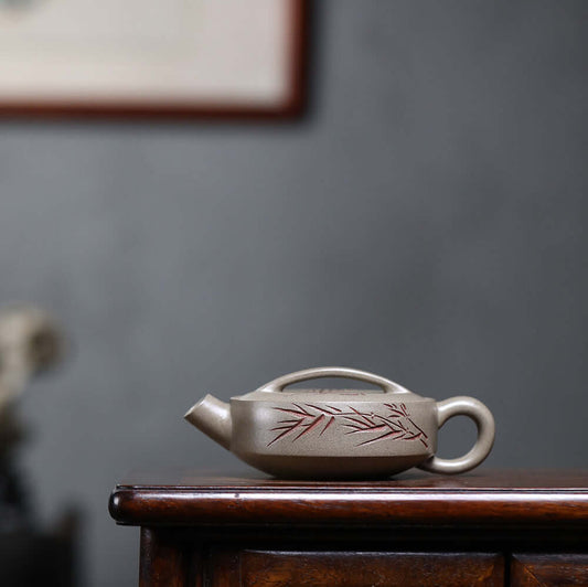 Handmade Yixing purple sand teapot with bamboo design, showcasing original Yixing craftsmanship for kung fu tea sets.