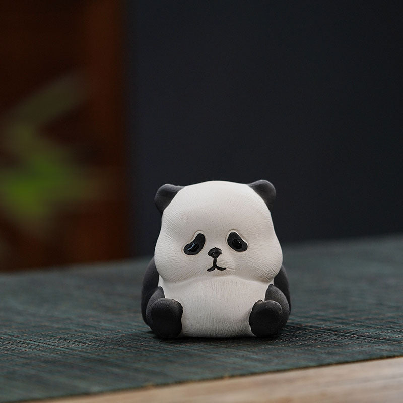 Handmade Yixing purple sand giant panda ornament, cute ceramic tea pet, ideal for tea lovers and collectors.