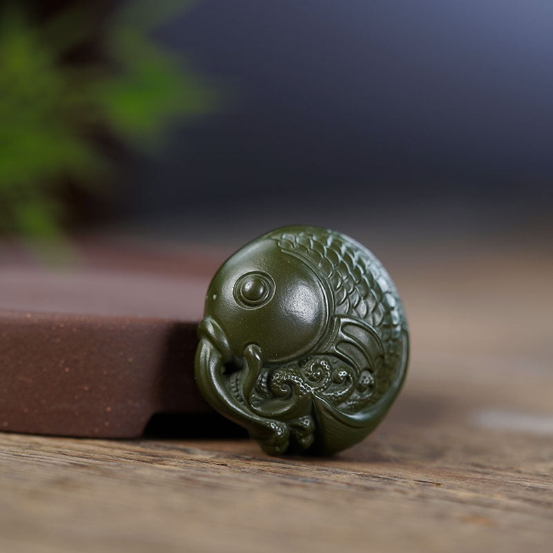 Handmade Yixing purple sand tea pet ornament, green clay fish sculpture for tea table decor.