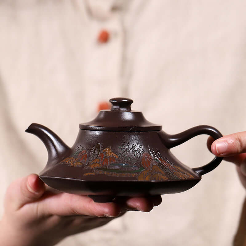 Handmade Yixing purple sand teapot with artistic design, showcasing traditional craftsmanship and elegant lines.