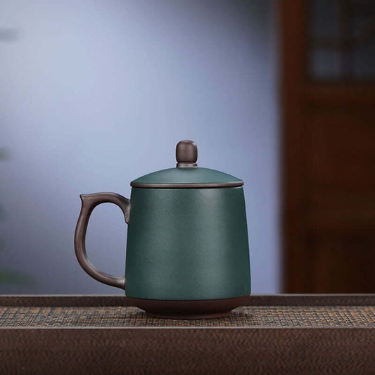 Handmade Yixing purple sand cup designed for tea, featuring an elegant cover by skilled craftsman, perfect gift for elders.