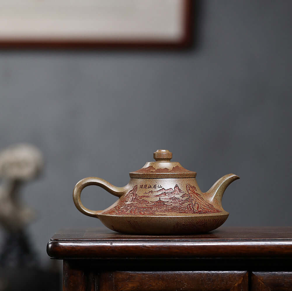 Handmade Yixing purple sand teapot with intricate landscape design, perfect for Kung Fu tea set.