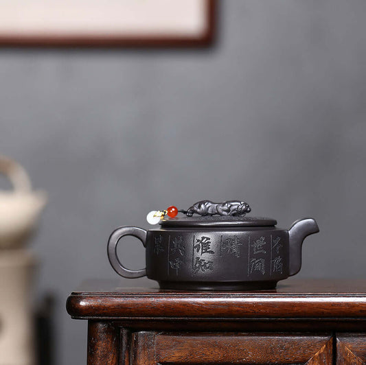 Handmade Yixing purple sand teapot featuring secret text, perfect for Chinese Kung Fu tea sets.