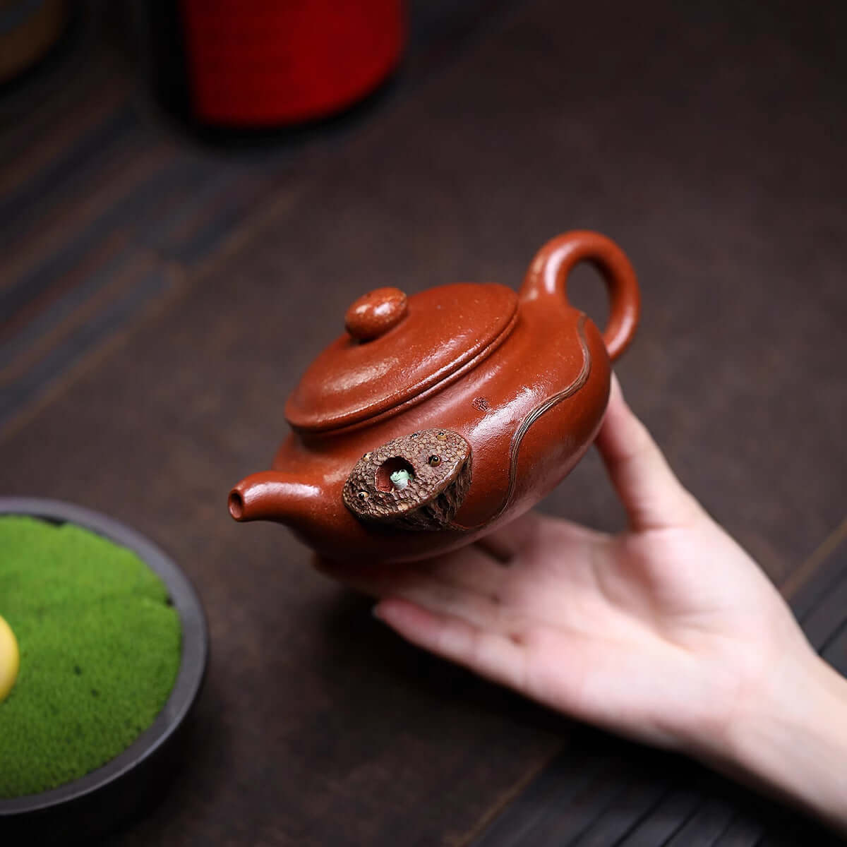 Handmade Yixing purple sand teapot with unique lid detail, perfect for kung fu tea ceremonies.