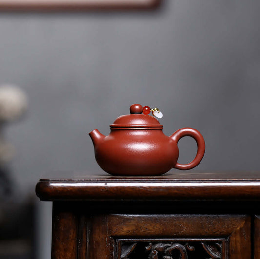 Handmade Yixing purple sand teapot with original mineral design, perfect for home Kung Fu tea sets.