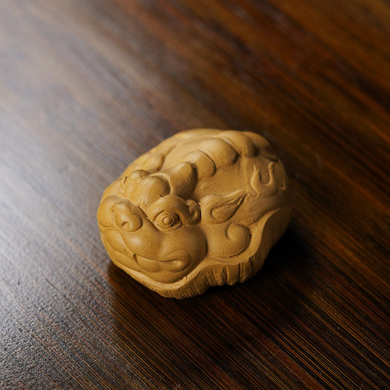 Handmade Yixing purple sand tea pet turtle sculpture for creative tea play and decoration on tea table.