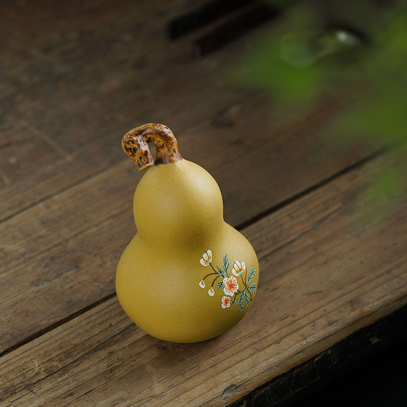 Handmade Yixing purple sand tea pet ornament in gourd shape, showcasing original craftsmanship and floral design, perfect for tea lovers.