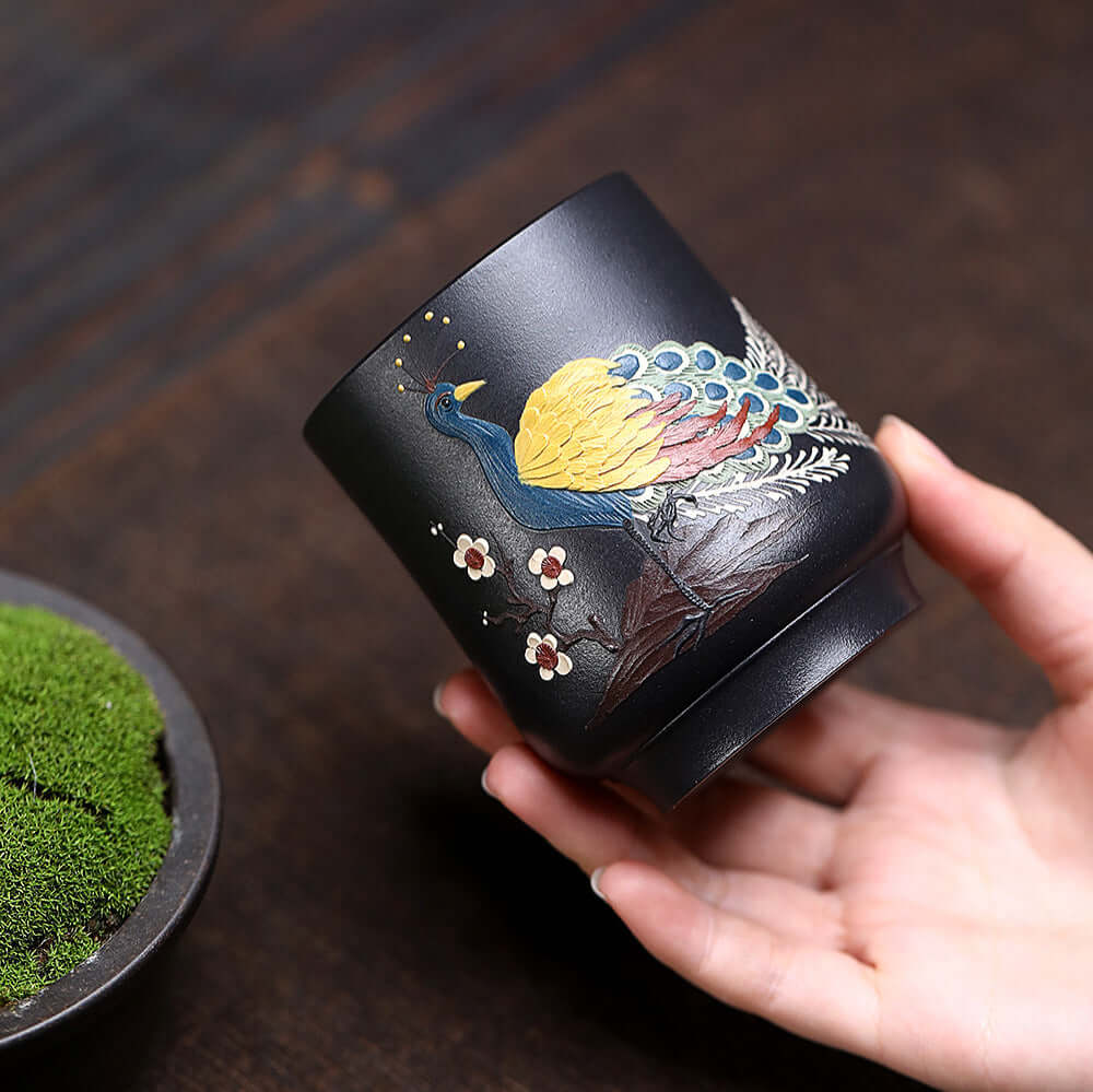 Handmade Yixing purple sand tea cup featuring a painted peacock design, perfect for Kung Fu tea sets.