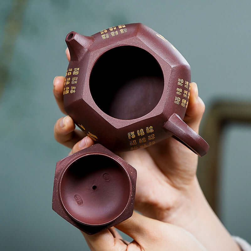 Handmade Yixing purple sand hexagonal Xi Shi teapot showcasing smooth interior and elegant design.