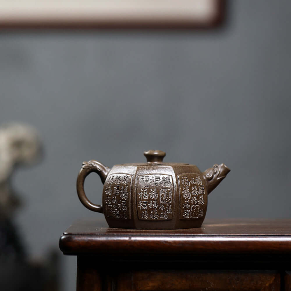 Handmade Yixing purple sand teapot with ancient ciphertext, showcasing traditional craftsmanship for kung fu tea.