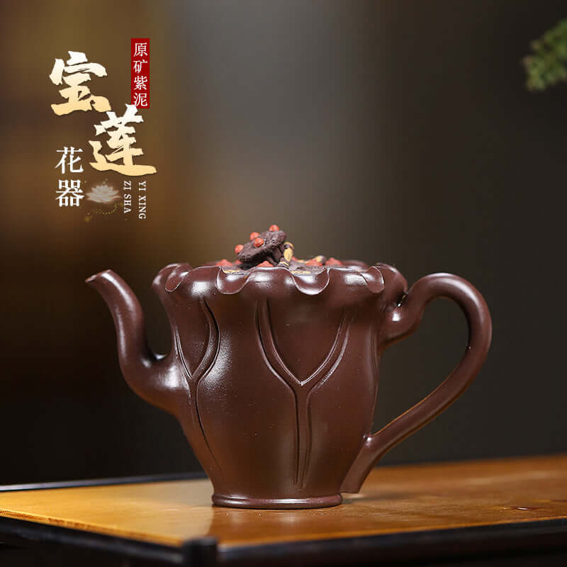 Handmade Yixing purple sand teapot with lotus design, showcasing elegant craftsmanship and rich purple clay.