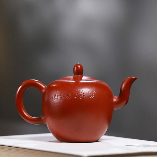 Handmade Yixing purple sand teapot featuring a smooth design, crafted from original red clay, ideal for tea enthusiasts.