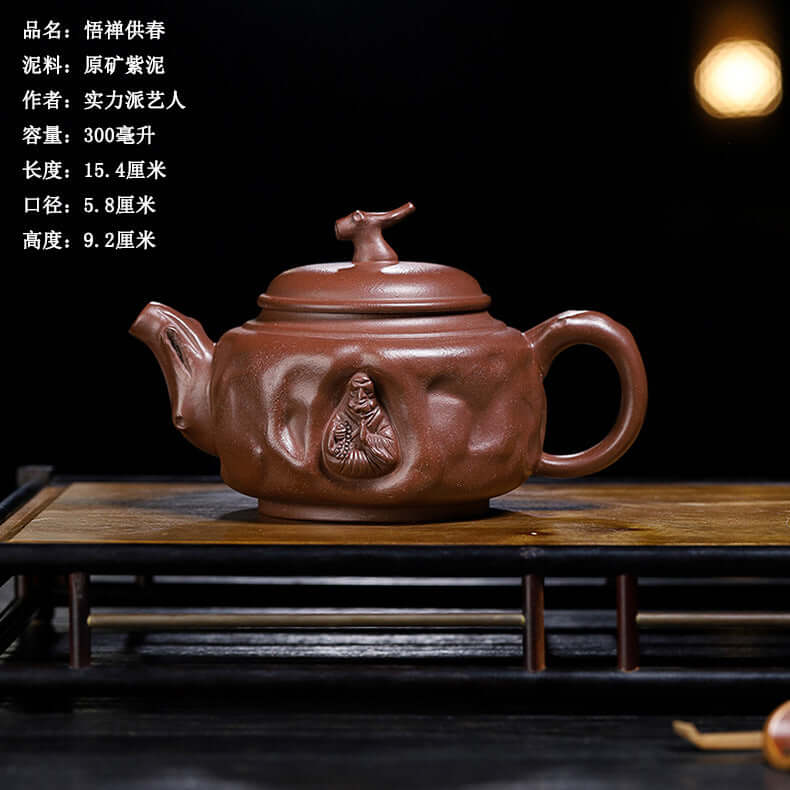 Handmade Yixing purple sand teapot with intricate design, perfect for tea lovers and high-end gifts.