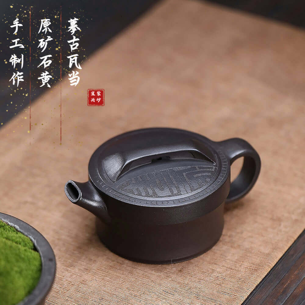 Handmade Yixing purple sand teapot with intricate design, ideal for Kung Fu tea, showcasing original craftsmanship.