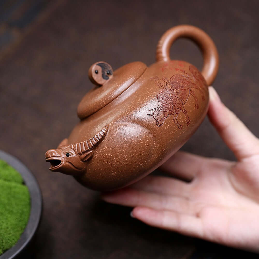Handmade Yixing purple sand teapot with a unique cow design, perfect for Kung Fu tea set enthusiasts.