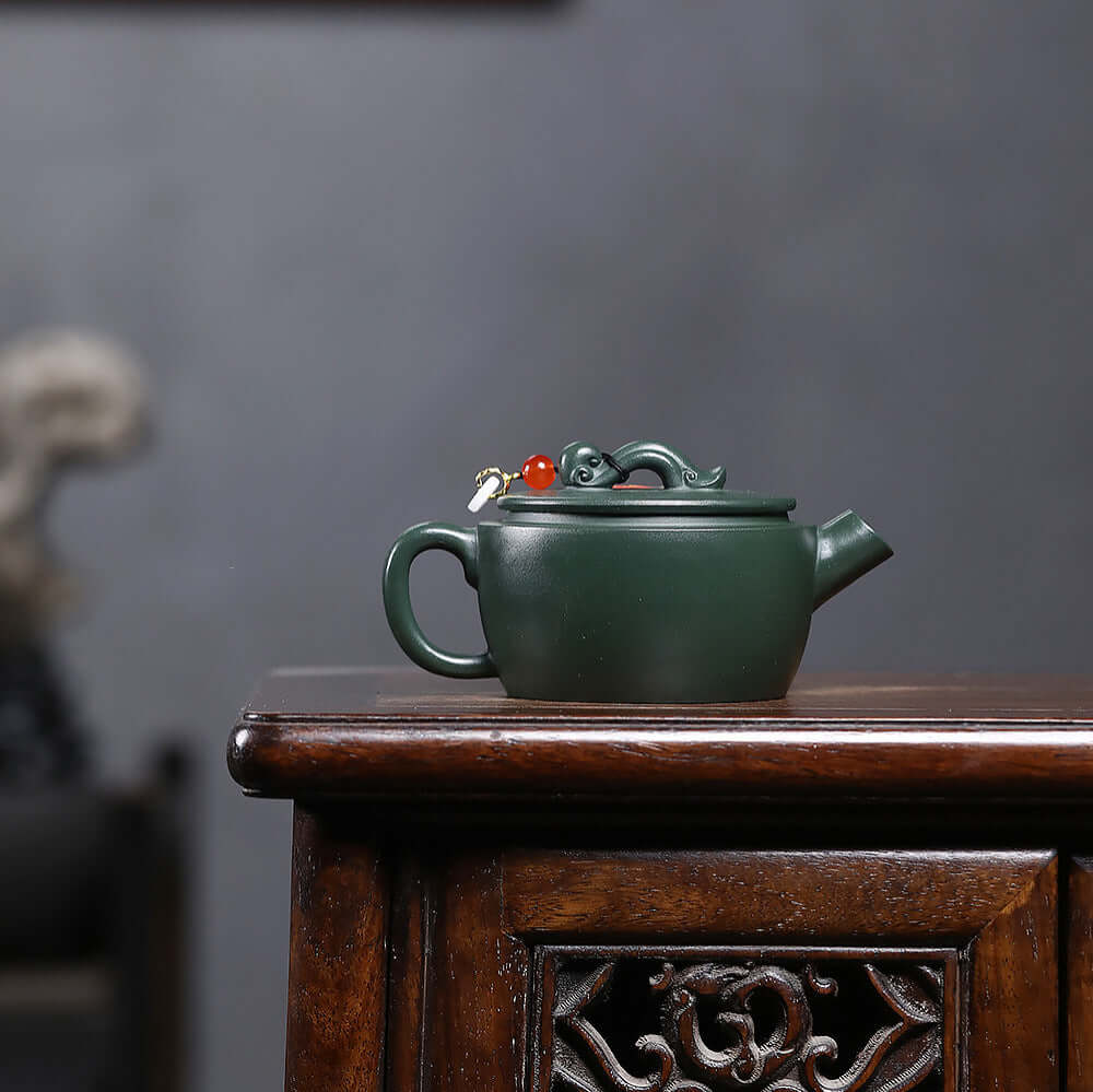 Handmade Yixing purple sand teapot with green mud design, featuring a ruyi motif, perfect for kung fu tea sets.