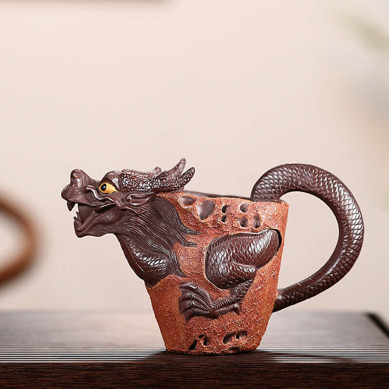 Handmade Yixing purple sand dragon cup featuring intricate craftsmanship and unique design.