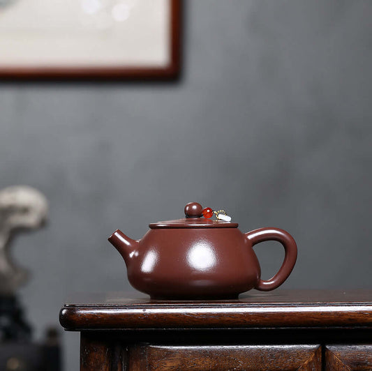 Handmade Yixing purple sand teapot with flat lid, perfect for Kung Fu tea brewing at home.