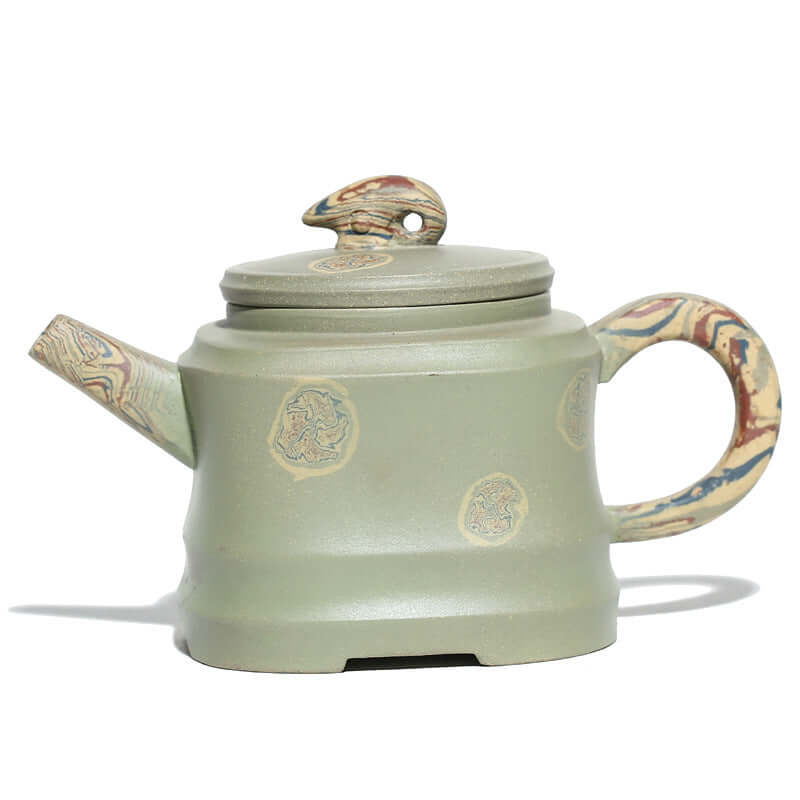 Handmade Yixing purple sand teapot with unique swirling design and natural green finish, perfect for kung fu tea set.