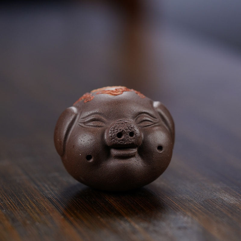 Handmade Yixing purple sand tea pet sculpture of a pig Bajie, perfect for tea table decor and enthusiasts.